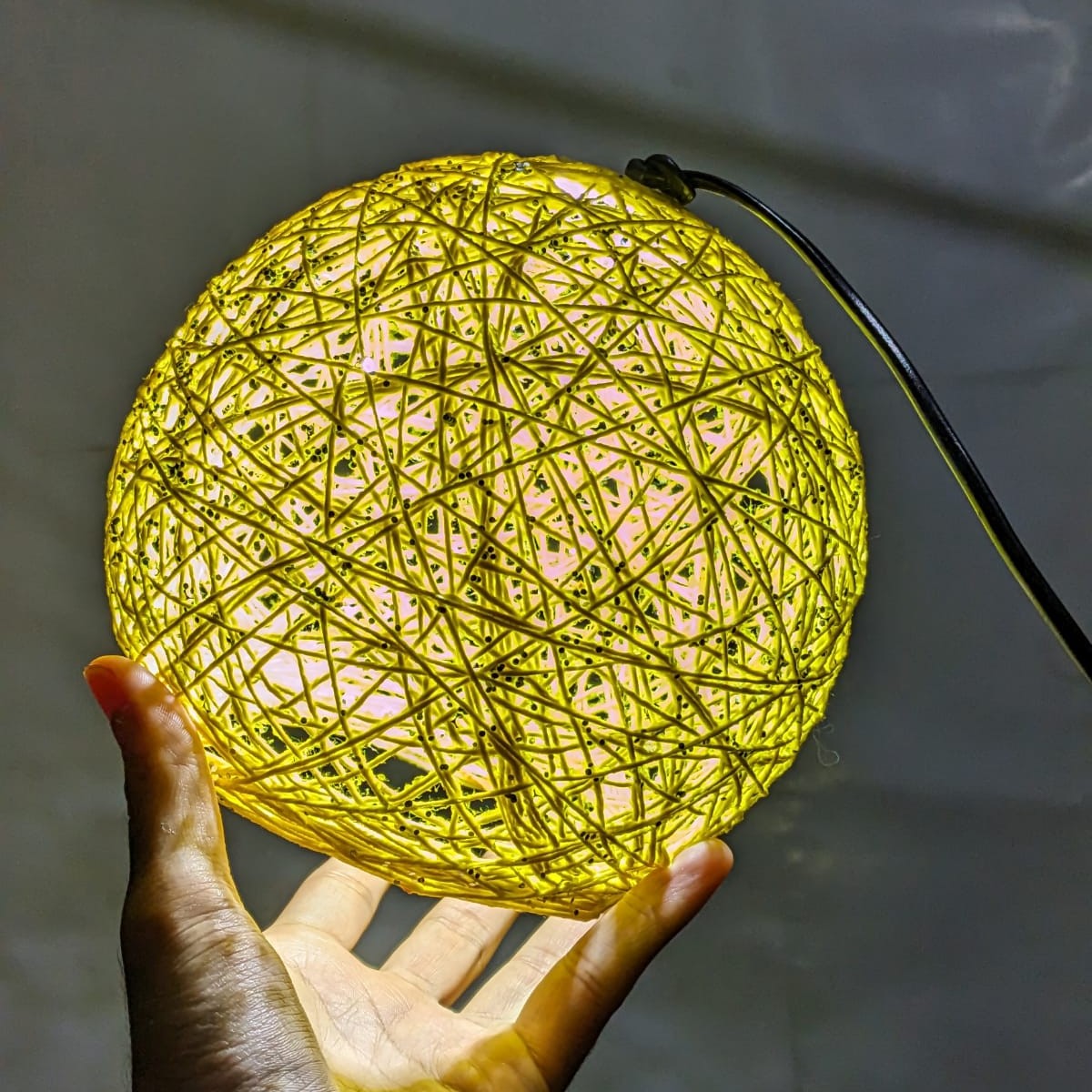 Decorative ball lamp styled as part of a living room interior.