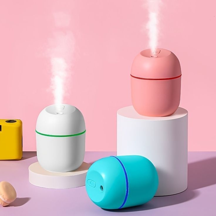 Mini silent USB humidifier and aroma diffuser with a compact design for home and office use.