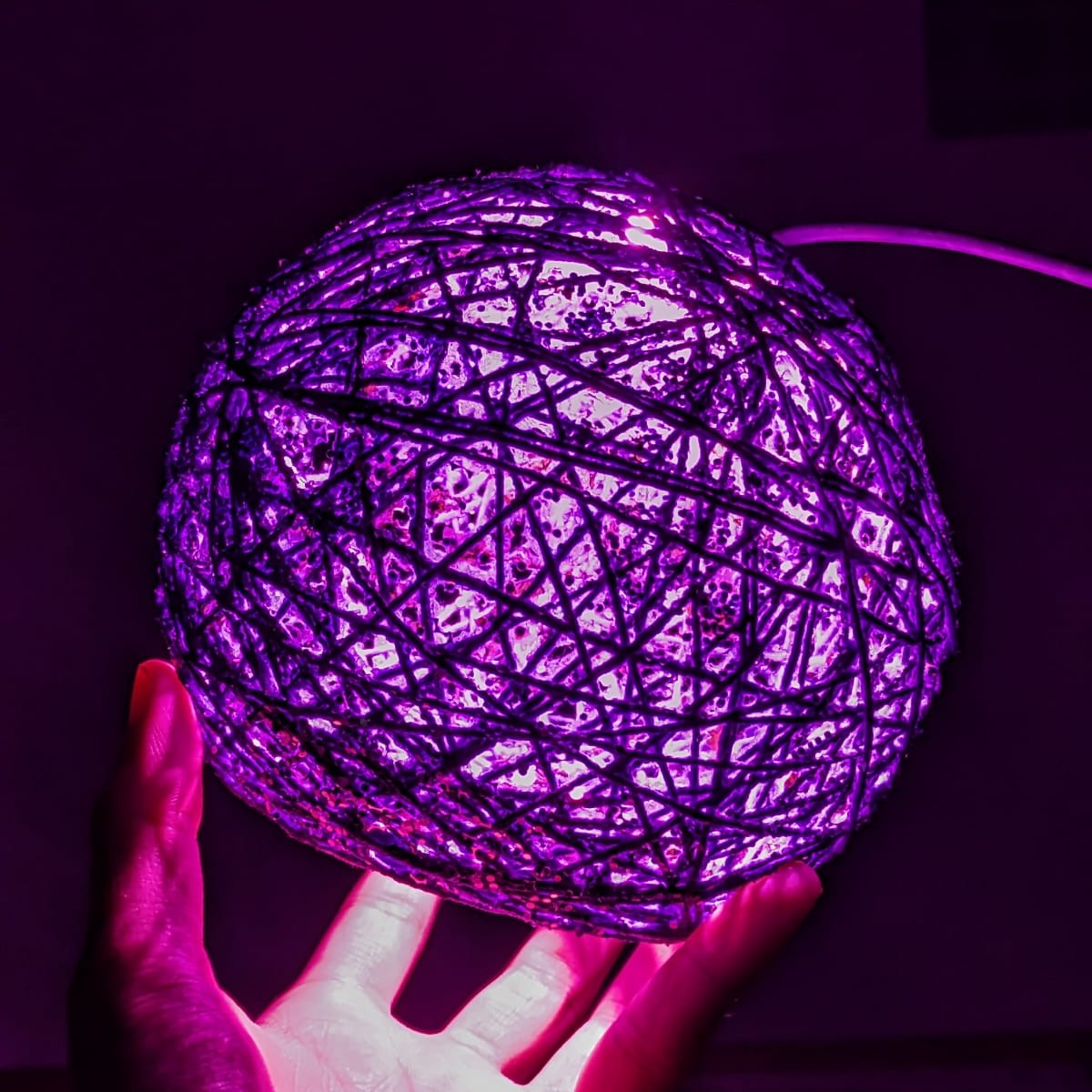 Close-up view of the string ball lamp showing its decorative construction and details.